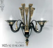 Two lights, black and 24k gold wall light, gold metal finishes.